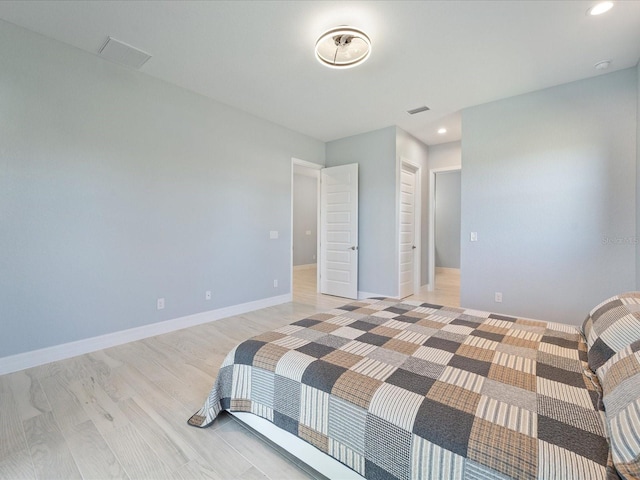 bedroom featuring light hardwood / wood-style floors