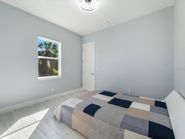 bedroom with light hardwood / wood-style flooring