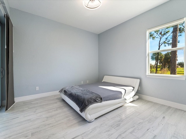 bedroom with light wood-type flooring