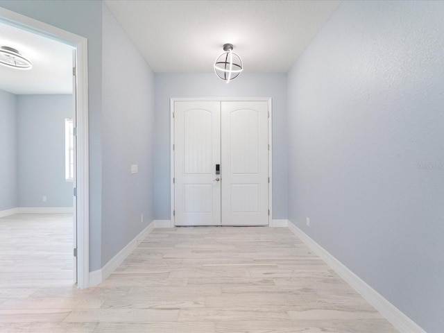 corridor featuring light hardwood / wood-style floors