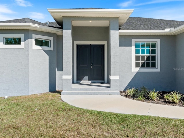 property entrance with a yard