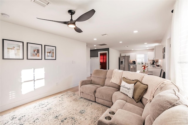 1010 Robinhood Dr, Punta Gorda, FL 33982 - living area with ceiling fan, recessed lighting, and wood finished floors