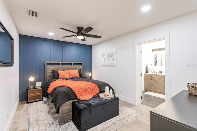 1010 Robinhood Dr, Punta Gorda, FL 33982 - bedroom with a decorative wall, ensuite bathroom, recessed lighting, ceiling fan, and baseboards