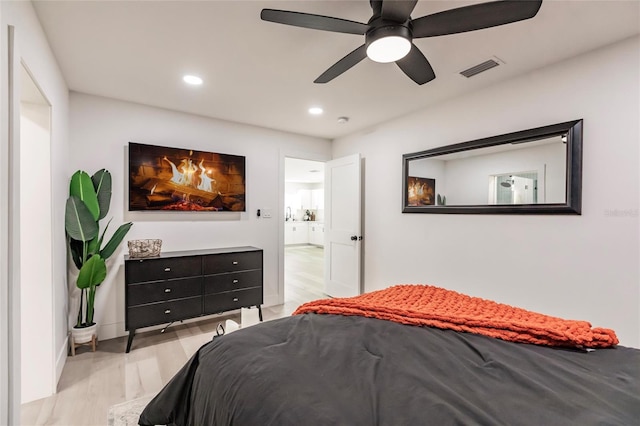 1010 Robinhood Dr, Punta Gorda, FL 33982 - bedroom with light wood finished floors, recessed lighting, and ceiling fan