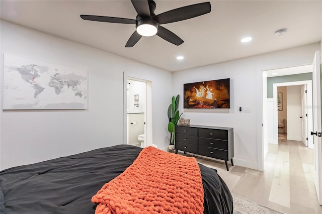 1010 Robinhood Dr, Punta Gorda, FL 33982 - bedroom featuring light wood-type flooring, recessed lighting, ensuite bath, a ceiling fan, and baseboards