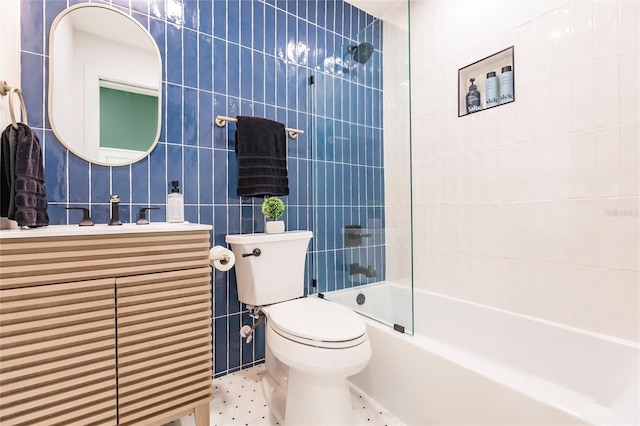 1010 Robinhood Dr, Punta Gorda, FL 33982 - full bathroom with tile walls, toilet, vanity, and tub / shower combination