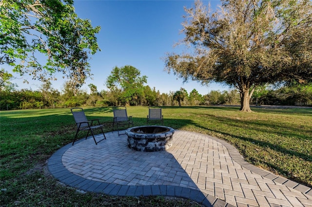 view of patio / terrace with an outdoor fire pit