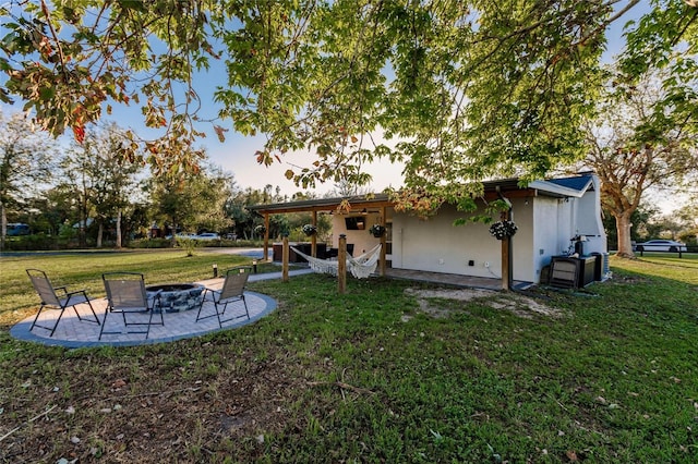 view of yard with a patio and a fire pit