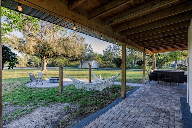 1010 Robinhood Dr, Punta Gorda, FL 33982 - view of patio with a hot tub and an outdoor fire pit