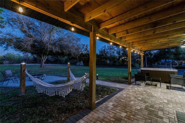 1010 Robinhood Dr, Punta Gorda, FL 33982 - view of patio featuring a hot tub and a fire pit