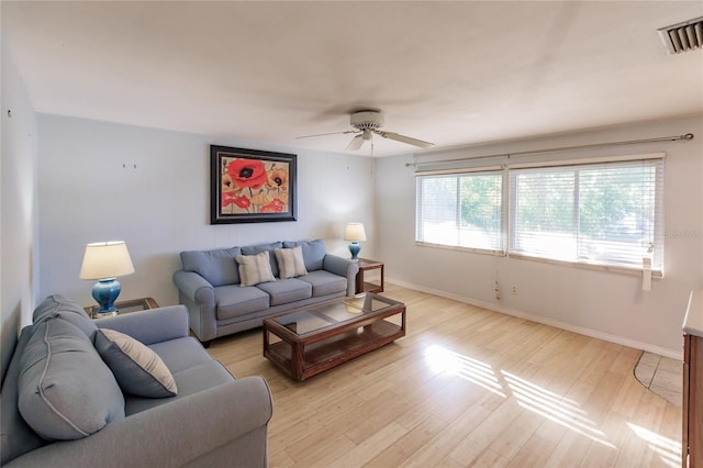 living room with ceiling fan and light hardwood / wood-style floors