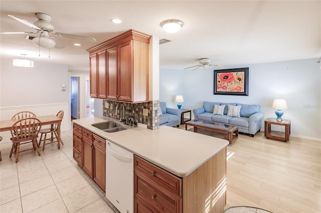 kitchen with ceiling fan, sink, tasteful backsplash, white dishwasher, and light tile patterned flooring