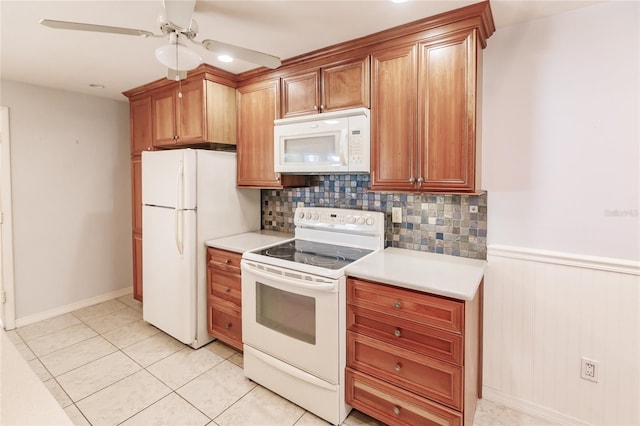 kitchen featuring decorative backsplash, ceiling fan, white appliances, and light tile patterned floors