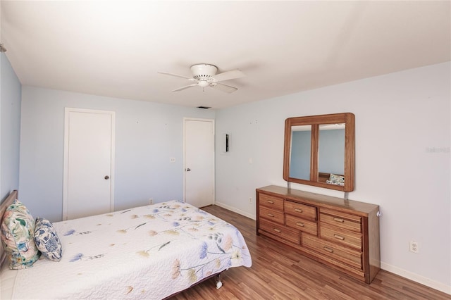 bedroom featuring hardwood / wood-style flooring and ceiling fan