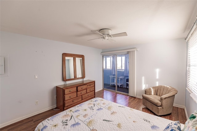 bedroom with ceiling fan, access to exterior, and dark wood-type flooring