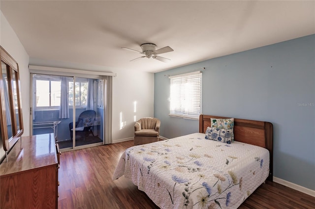 bedroom featuring ceiling fan, dark hardwood / wood-style flooring, and multiple windows