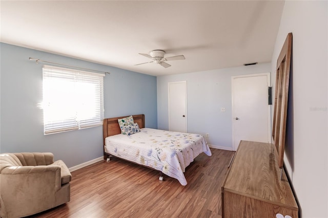 bedroom with hardwood / wood-style floors and ceiling fan