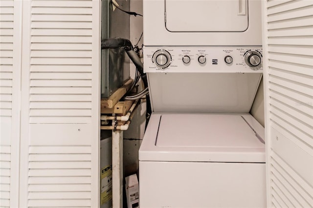 laundry room featuring stacked washer and dryer