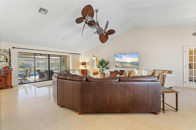 living room featuring ceiling fan and lofted ceiling