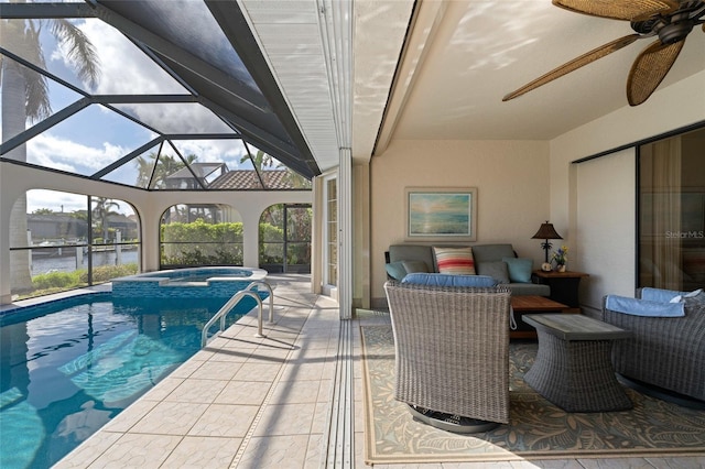 view of pool with an in ground hot tub, a patio, a water view, and a lanai