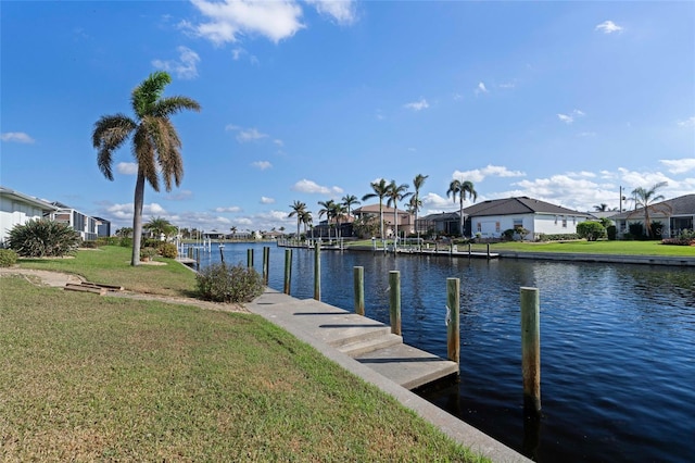 dock area featuring a yard and a water view