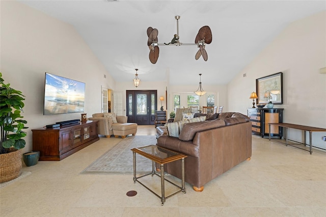 living room with ceiling fan and high vaulted ceiling