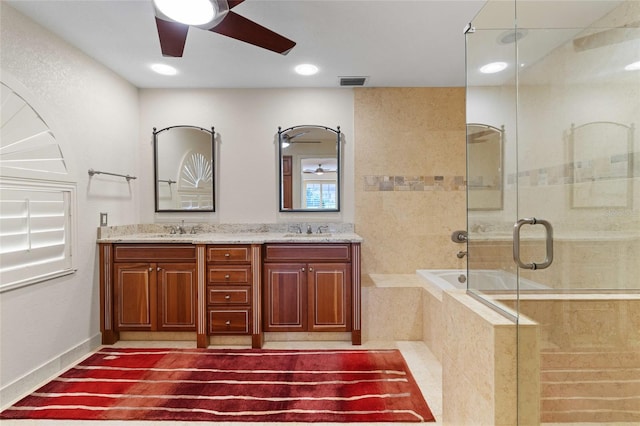 bathroom featuring vanity, separate shower and tub, and ceiling fan