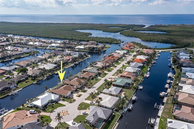 birds eye view of property featuring a water view