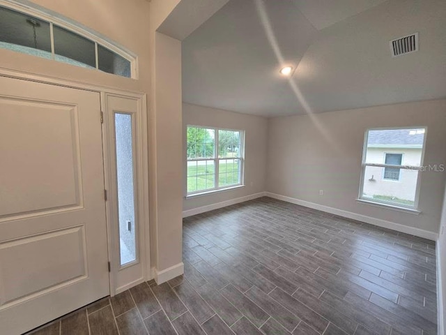 foyer with lofted ceiling, recessed lighting, wood finish floors, visible vents, and baseboards