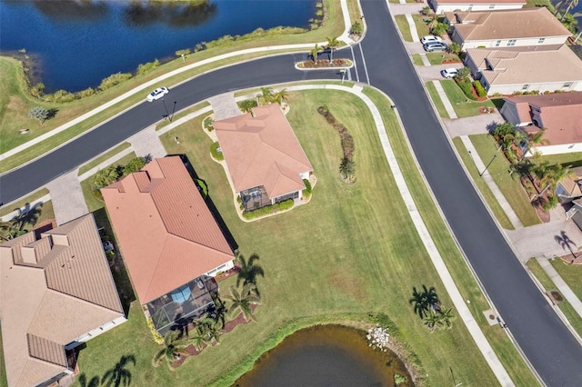 birds eye view of property featuring a water view