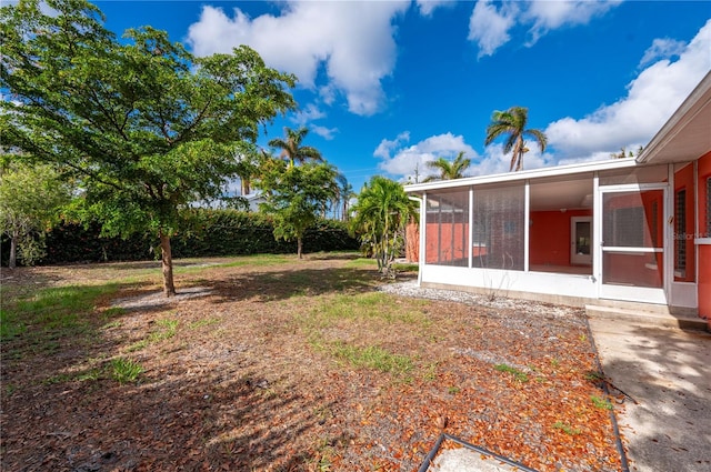 view of yard featuring a sunroom