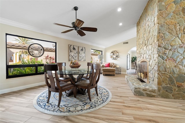 dining space with plenty of natural light, ceiling fan, light wood-type flooring, and crown molding