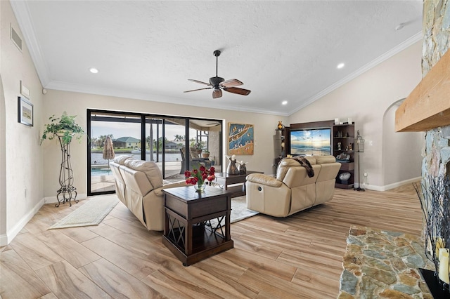 living room with crown molding, ceiling fan, vaulted ceiling, and light wood-type flooring