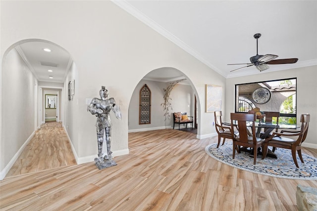 dining area featuring crown molding, ceiling fan, and light wood-type flooring