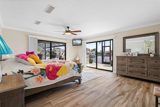 bedroom with a water view, crown molding, ceiling fan, access to exterior, and light wood-type flooring