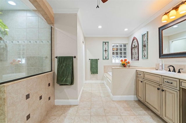 bathroom with vanity, tile patterned floors, a bathing tub, crown molding, and ceiling fan