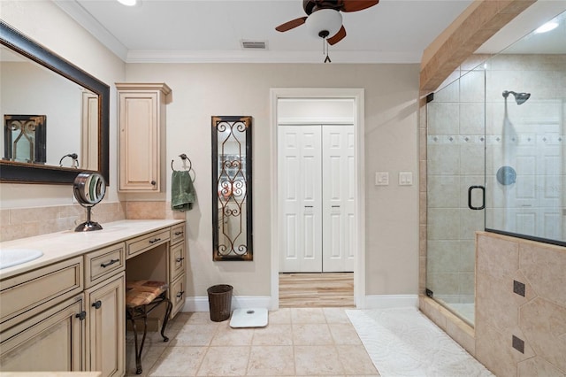 bathroom featuring vanity, ceiling fan, ornamental molding, walk in shower, and wood-type flooring