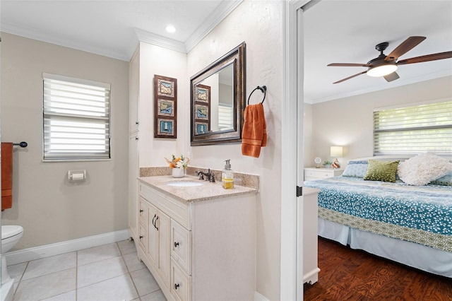 bathroom featuring vanity, tile patterned floors, ceiling fan, toilet, and ornamental molding