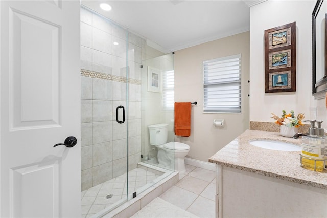 bathroom with vanity, tile patterned flooring, toilet, ornamental molding, and a shower with shower door