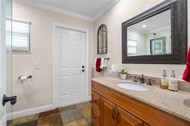 bathroom with crown molding and vanity