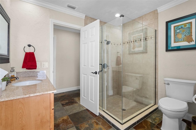 bathroom featuring crown molding, a shower with door, vanity, and toilet