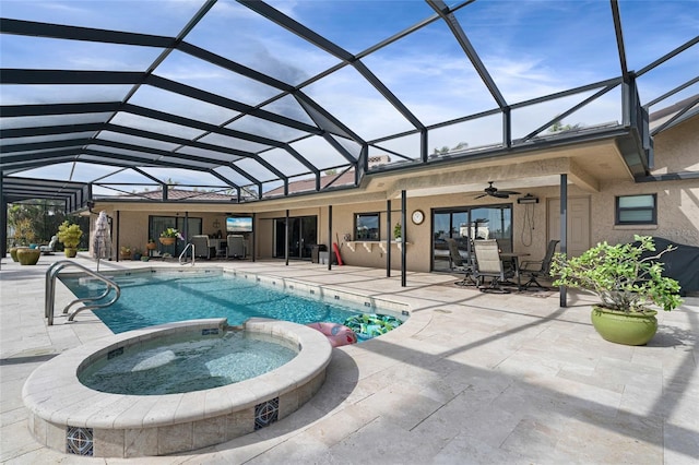 view of swimming pool featuring ceiling fan, a patio area, a lanai, and an in ground hot tub