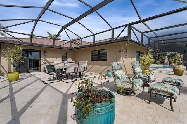 view of patio / terrace featuring glass enclosure