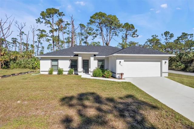 view of front of house with a front yard and a garage