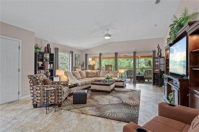 living room with ceiling fan, a wealth of natural light, and lofted ceiling