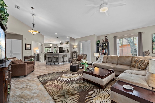 living room featuring lofted ceiling and ceiling fan