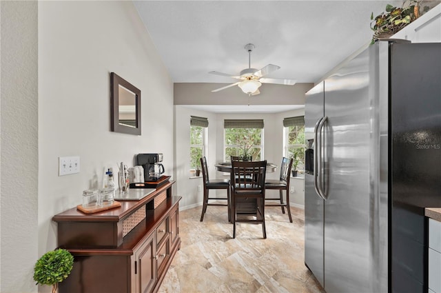 dining space featuring ceiling fan