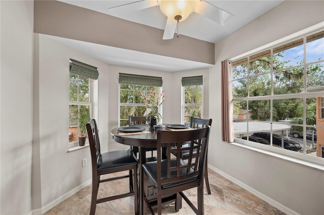 dining space with ceiling fan