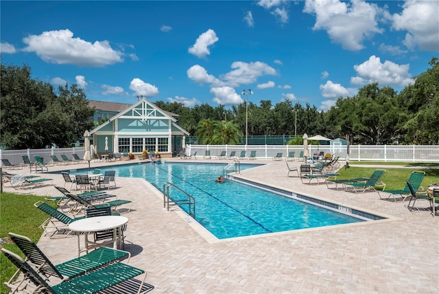 view of swimming pool with a patio area