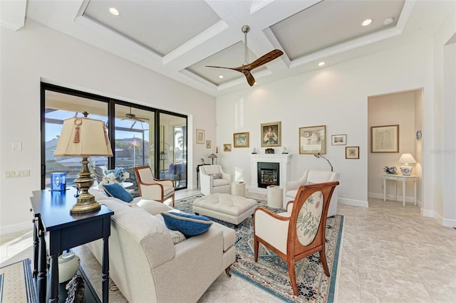 living room with ceiling fan, beamed ceiling, a high ceiling, and coffered ceiling